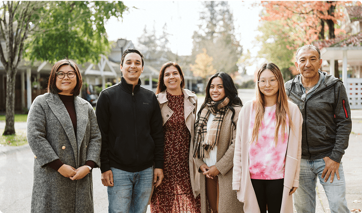 A group of people smiling at the camera.