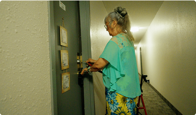 A tenant opening their front door.