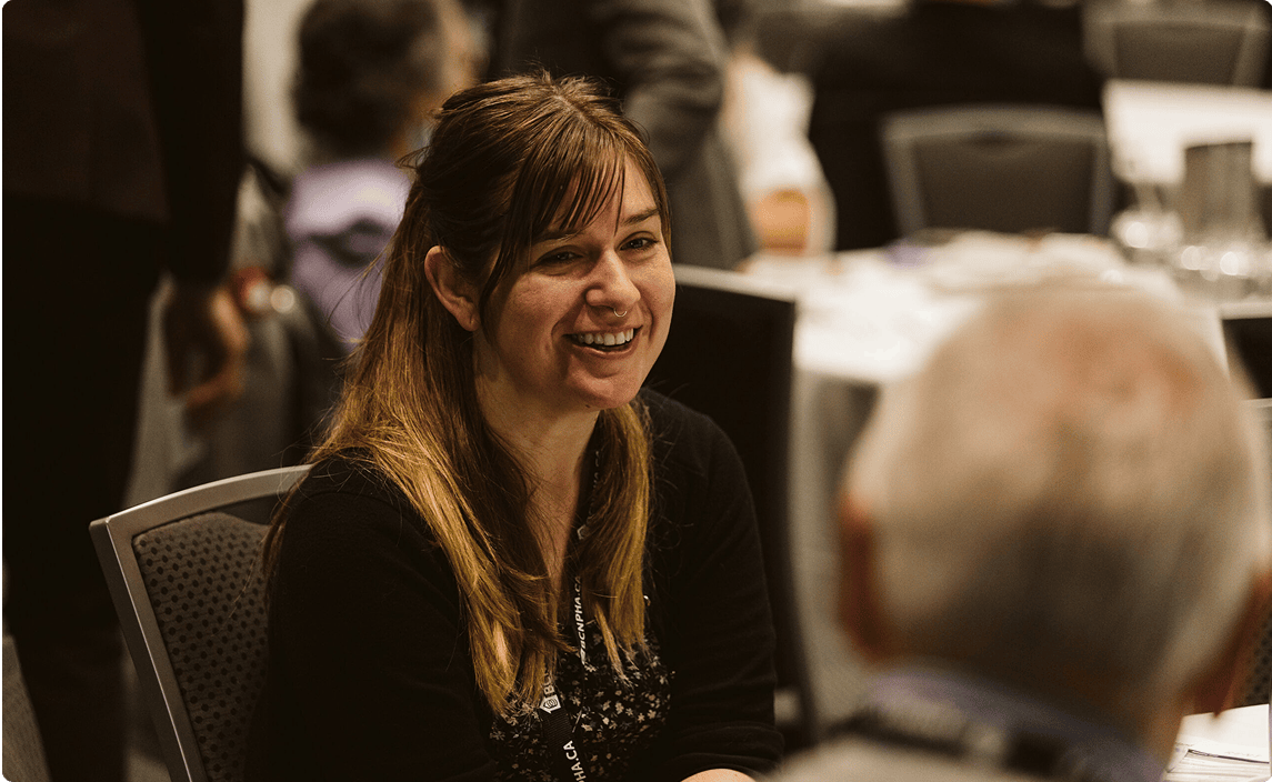 Attendees speaking at a RENT conference in the Lower Mainland, BC.
