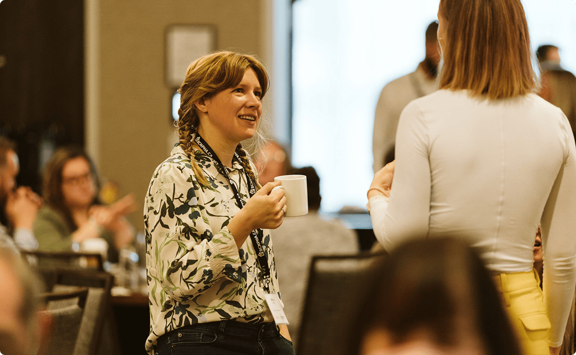 Attendees speaking at a RENT conference in Northern BC.