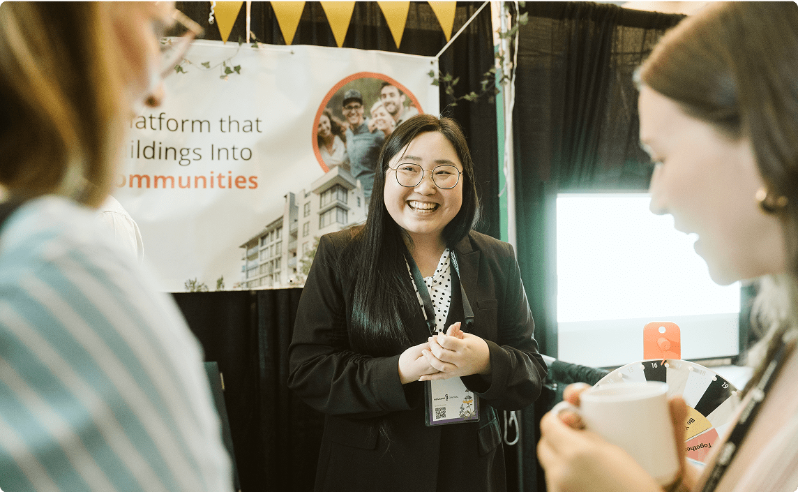 A women presenting at a trade show.