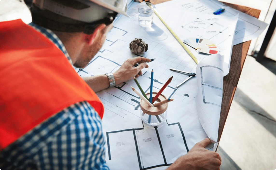An engineer reviewing plans.