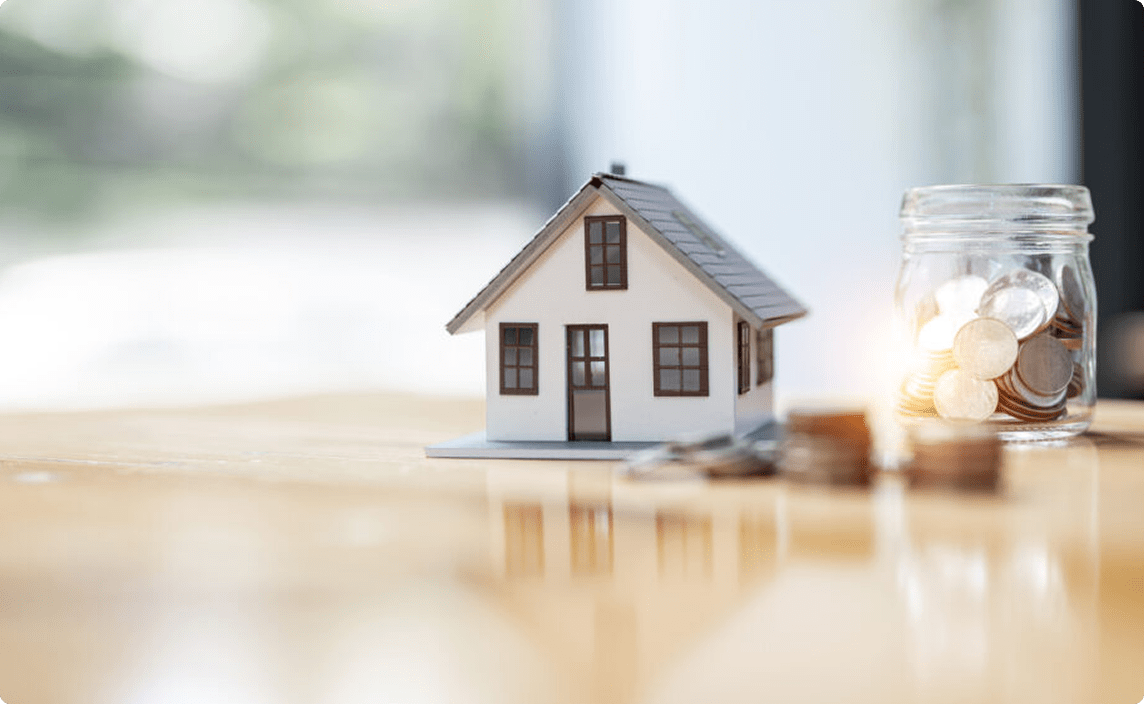 A small toy house on a table.