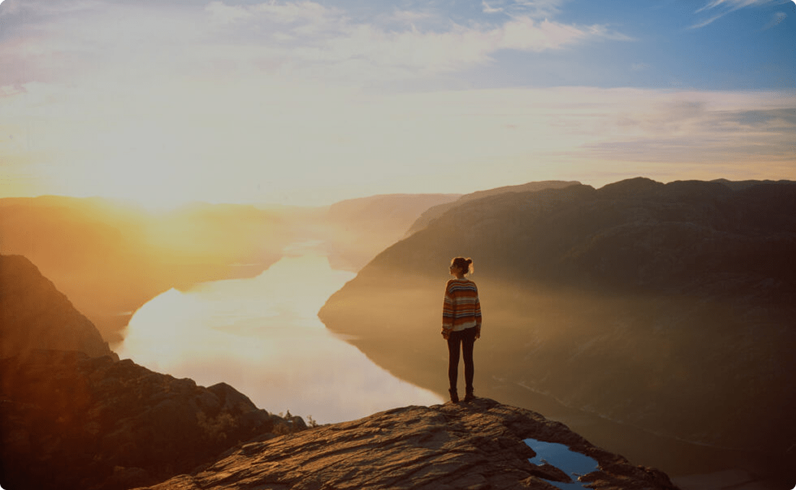 A person looking out over a river.