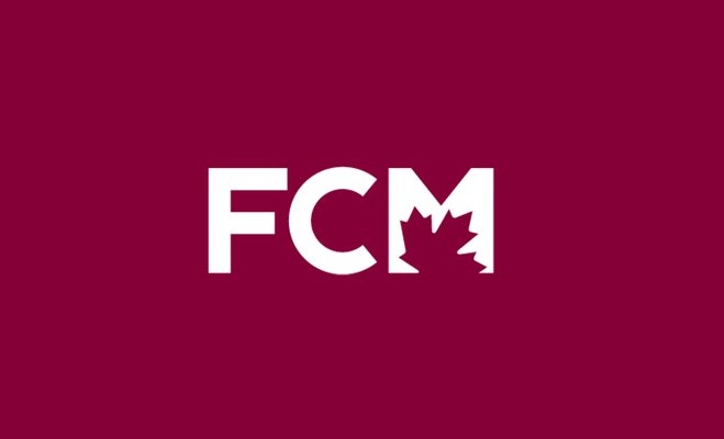 An image of the FCM logo on a dark background.