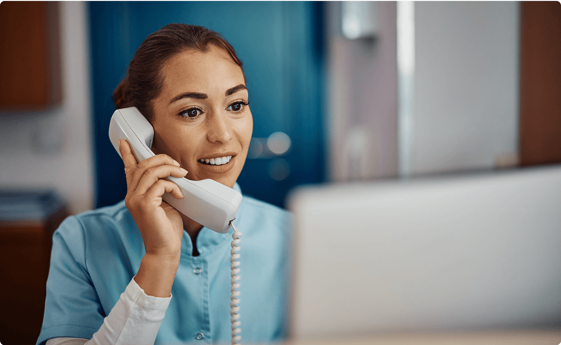 A woman answering the phone.