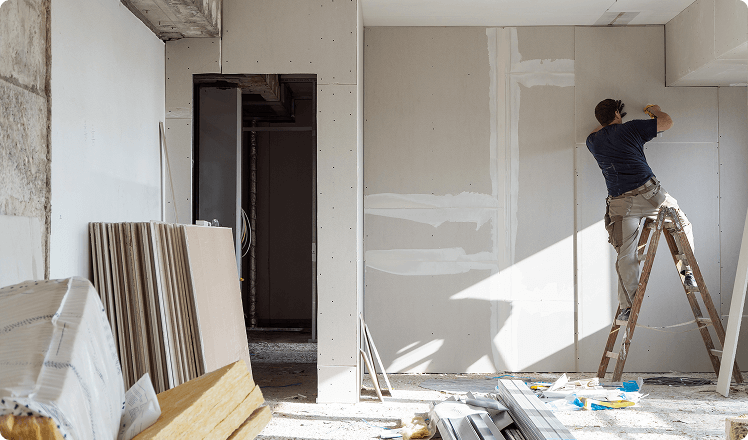 A worker retrofitting a home.