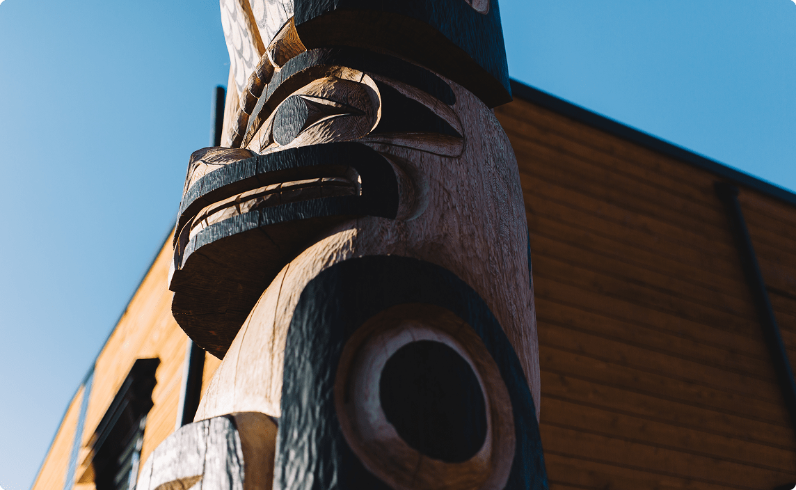 A closeup of a totem pole.