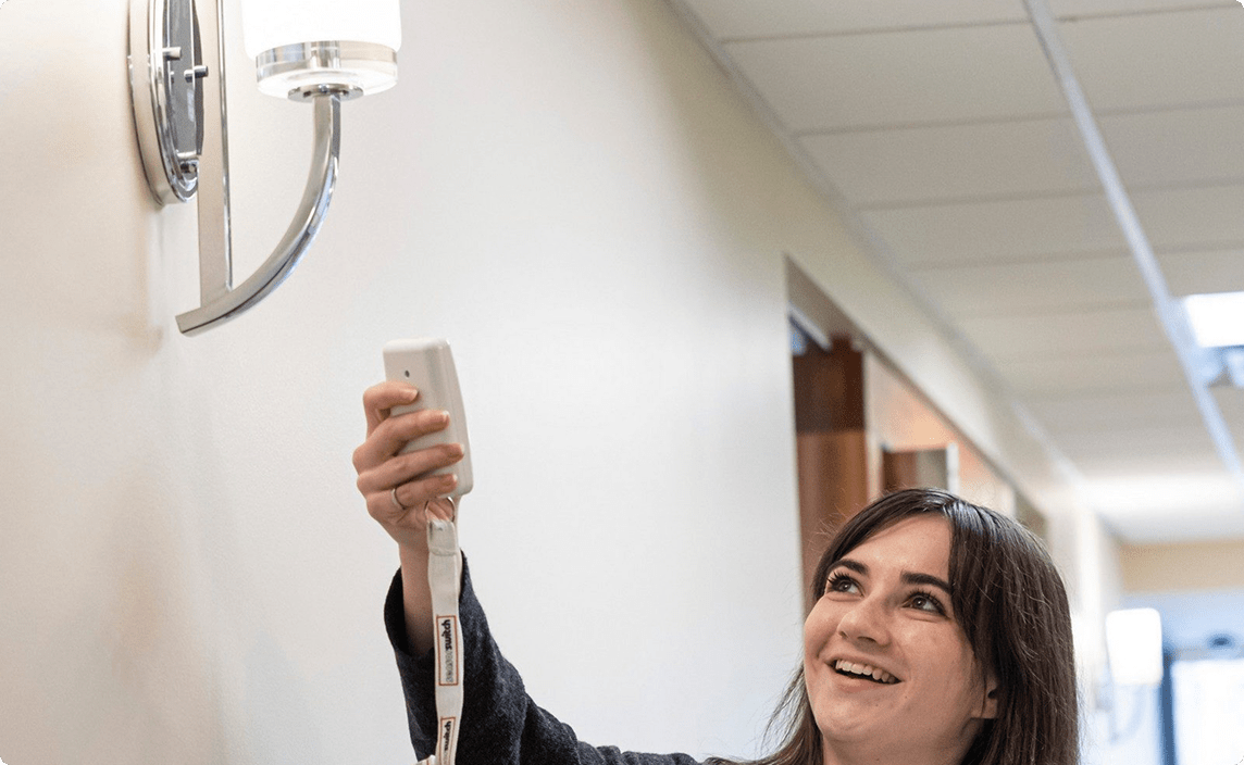 A BCNPHA team member turning on a light.