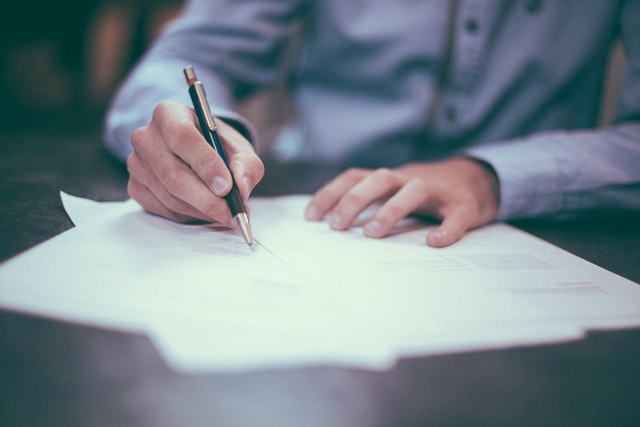 A man working over some documents.